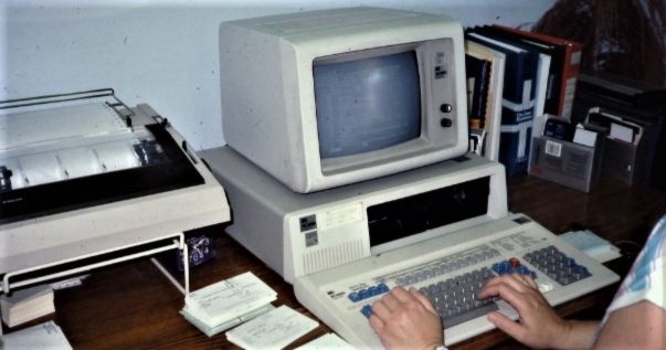 person using the old apple computers