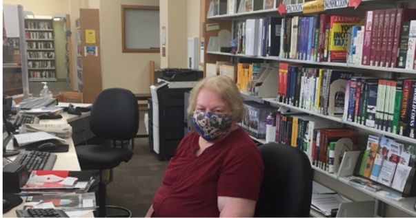 library staff member with mask on