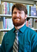 Joel with teal shirt and grey tie