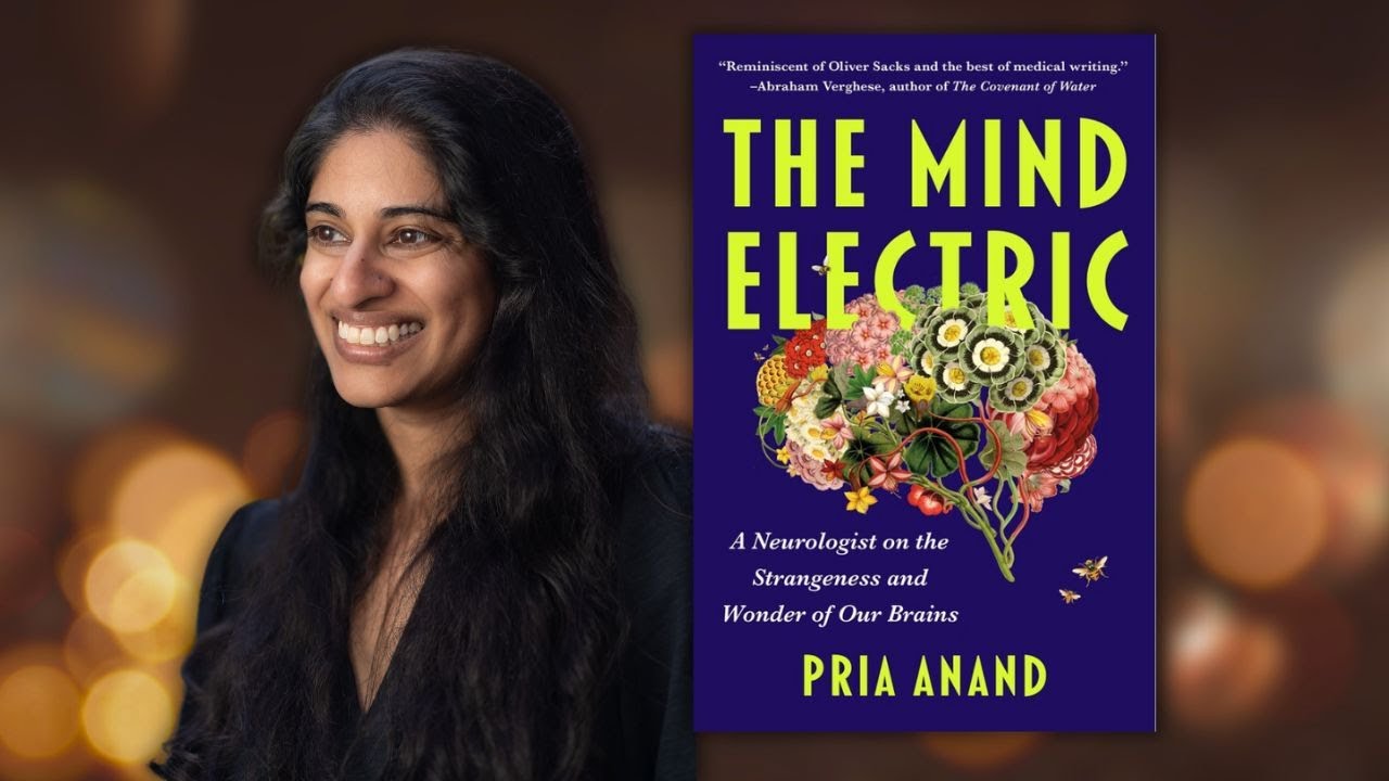 author with black shirt smiling beside blue book cover with drawing of a brain