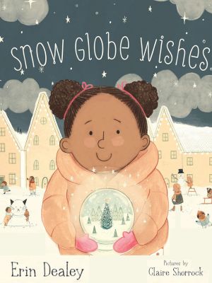 little girl with pink winter coat on holding a snow globe outside in the snow