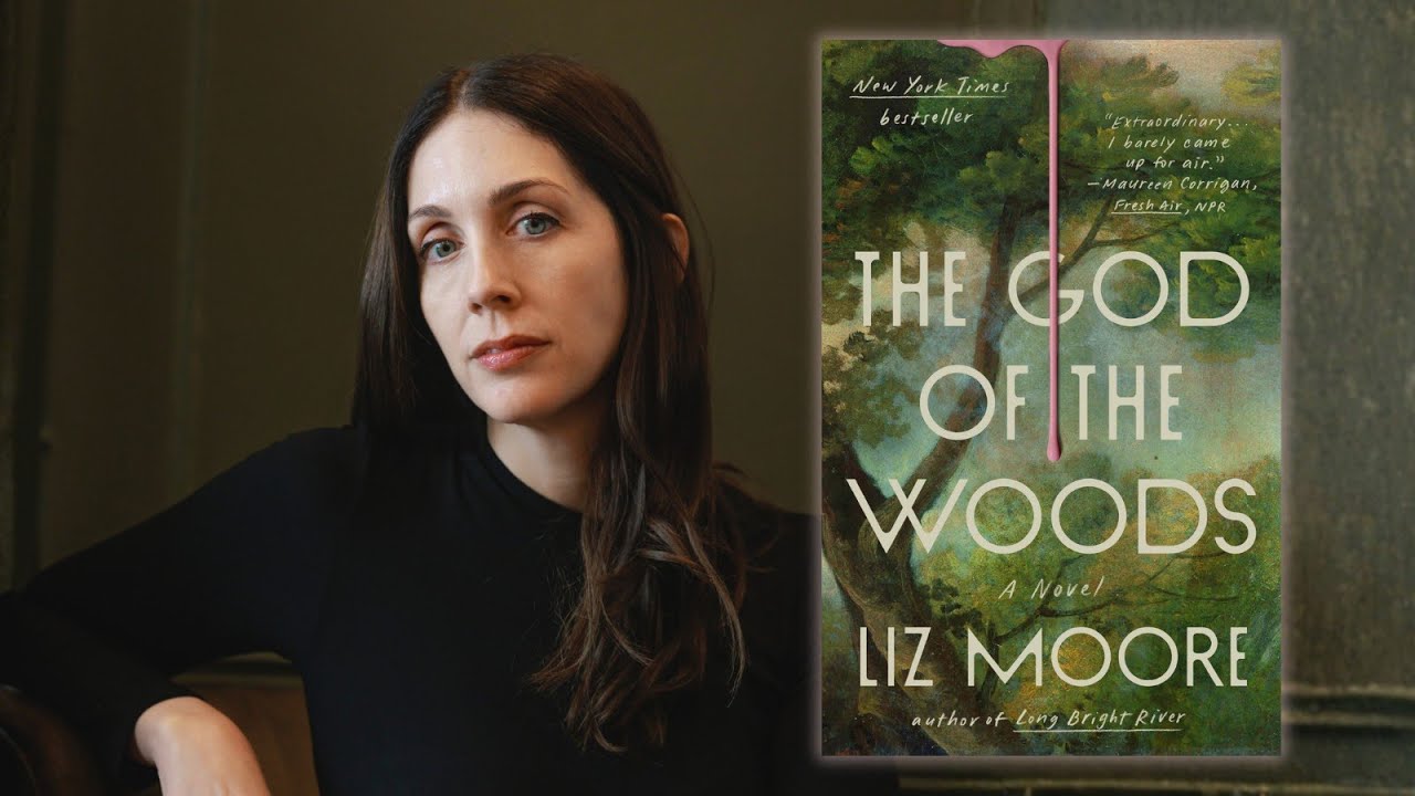 author in black sweater beside book cover showing a dark forest 