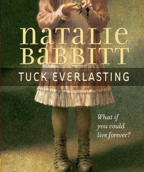 little girl holding and petting a frog