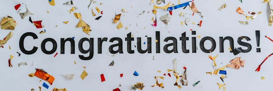 black te4xt with colorful confetti in the background