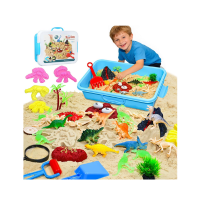 kid playing in sandbox with dino toys inside it