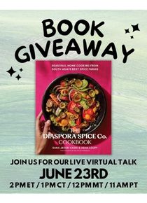 book with bright pink cover and a pan cooking vegetables 