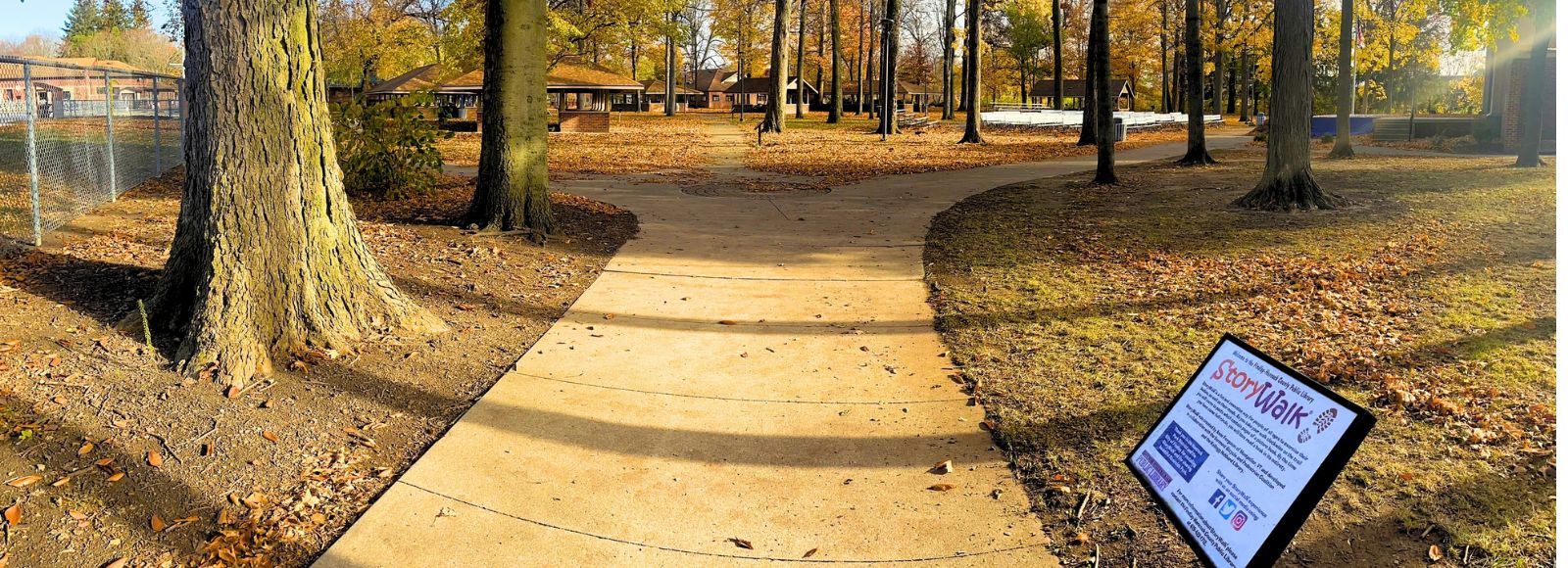 Riverside Park in the fall with StoryWalk sign 