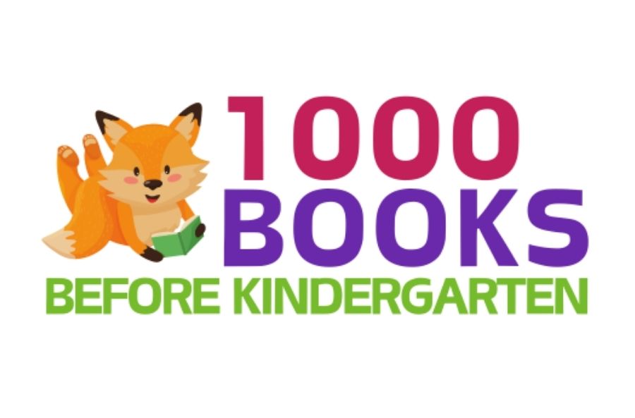 little fox reading a book beside text in pink, purple and bright green