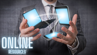 man holding cell phone, computer, and tablet