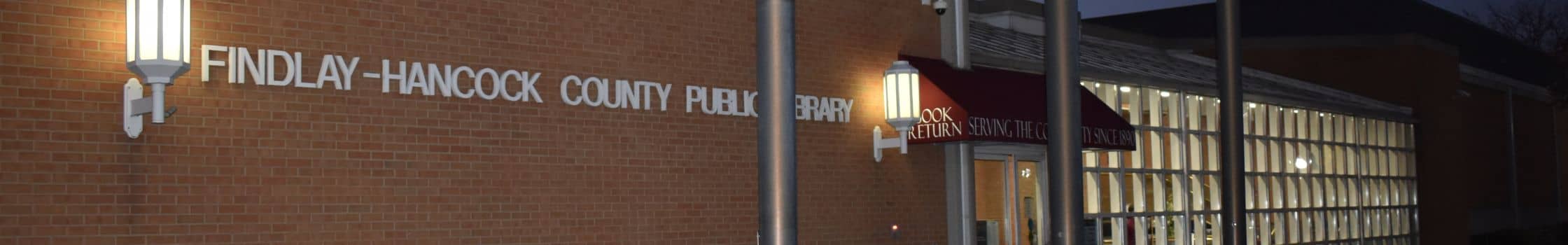 front of library at night 