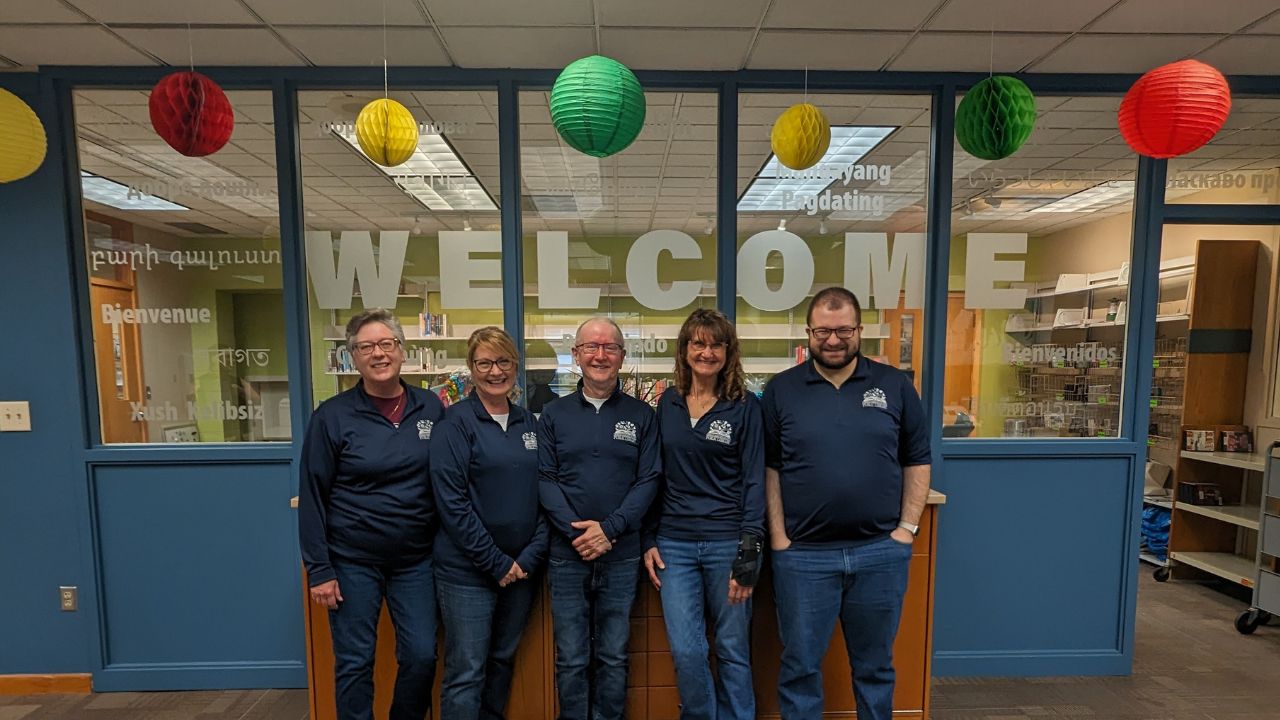 circulation staff in front of welcome window