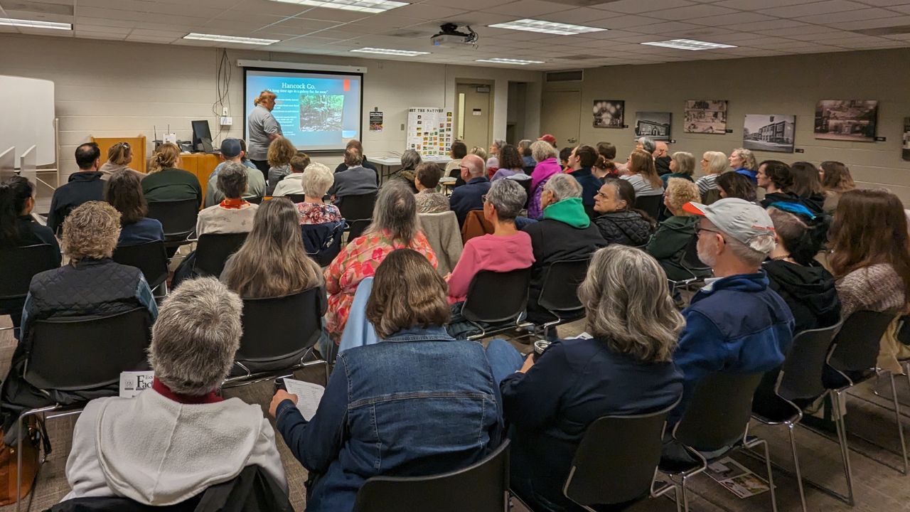 room full of people learning about Hancock County