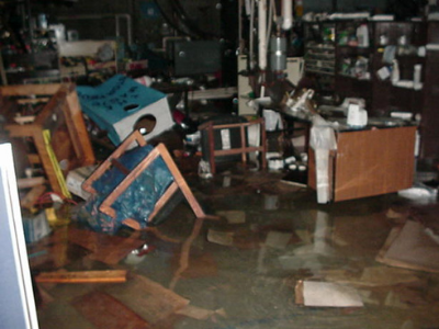photo of offices flooded with chairs floating in the water