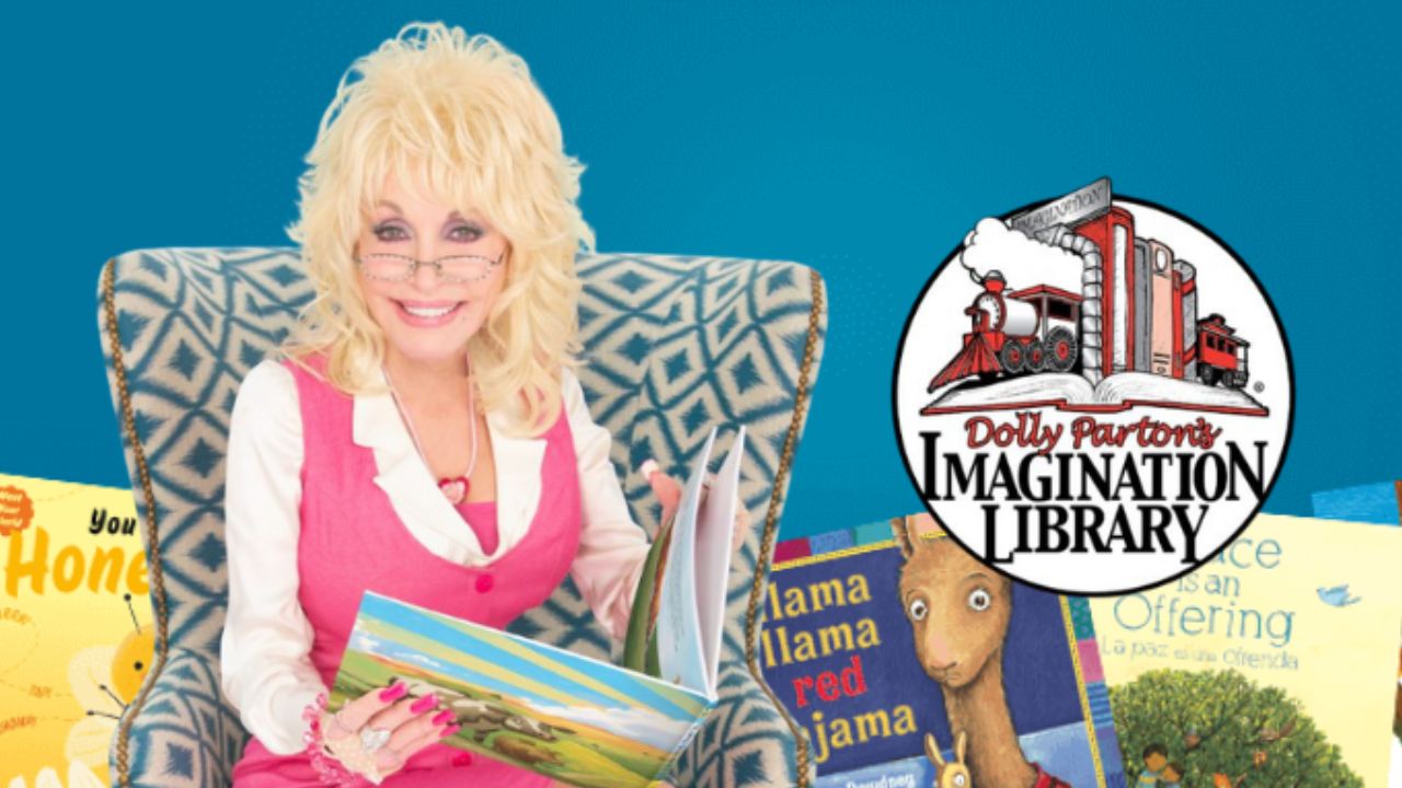 Dolly Parton holding a children's book