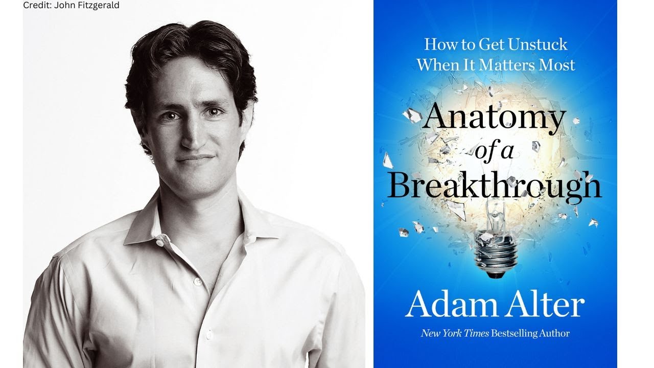 author with blue book cover showing broken lightbulb