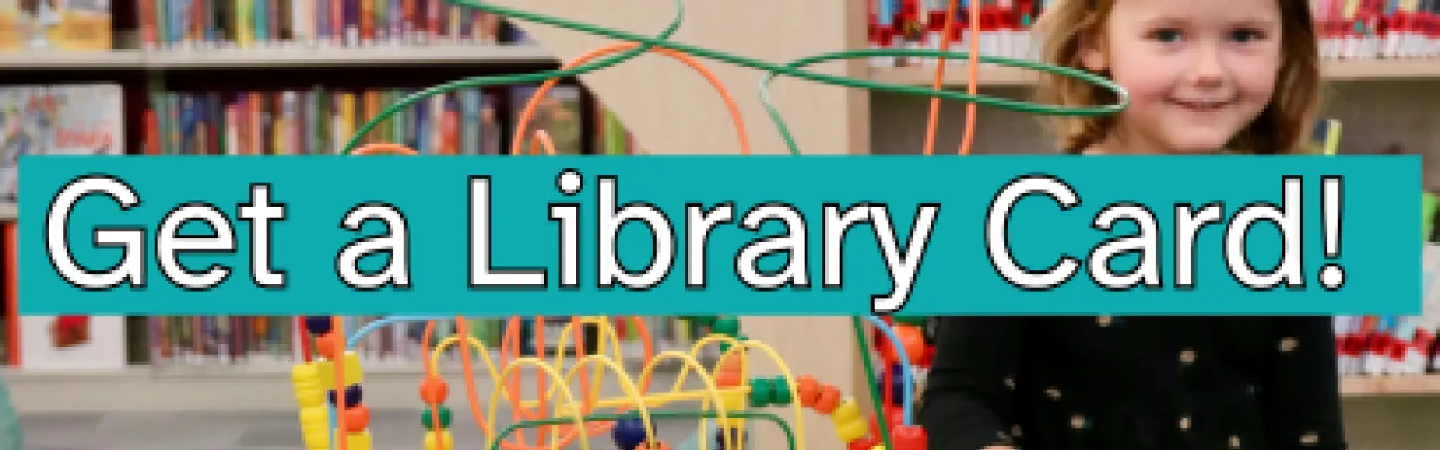 little girl playing at the library